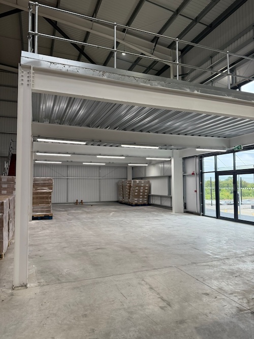 LED batten lighting under mezzanine &mdash; commercial warehouse Chester