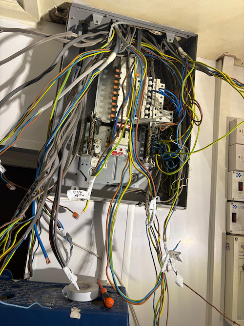 Messy tangle of old wiring at Joules Brewery, Offley Arms Madeley, before three phase rewire by Portcullis Power Solutions