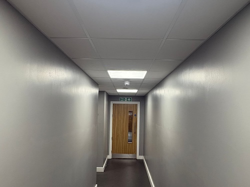 Emergency lighting installed in corridor at PackagingOne warehouse Middlewich by Portcullis Power Solutions
