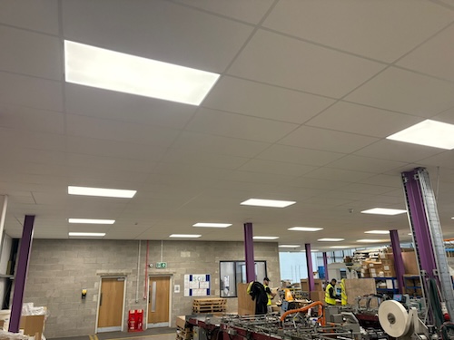 Factory floor with completed LED panel lighting system at PackagingOne warehouse