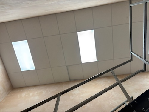 Overhead view of LED panel lighting grid installed throughout PackagingOne warehouse in Middlewich